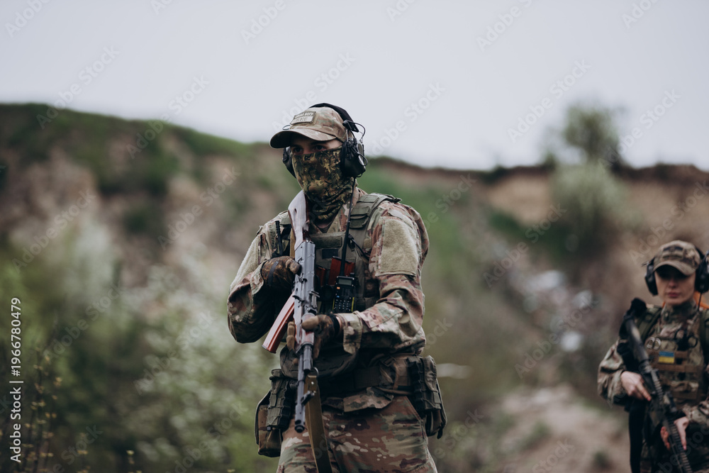 Fototapeta premium Ukrainian male and female soldiers practicing