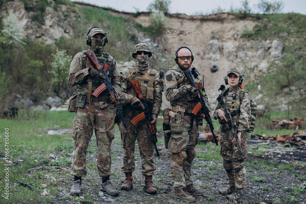 Fototapeta premium A group of four Ukrainian soldiers practicing at the range