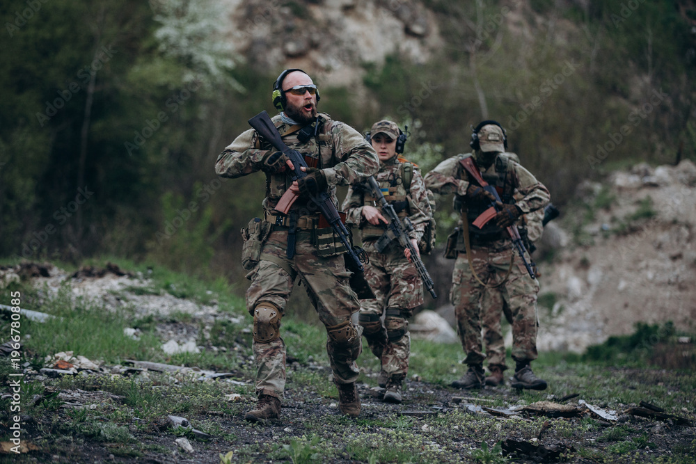 Fototapeta premium A group of Ukrainian militarymen patroling the territory