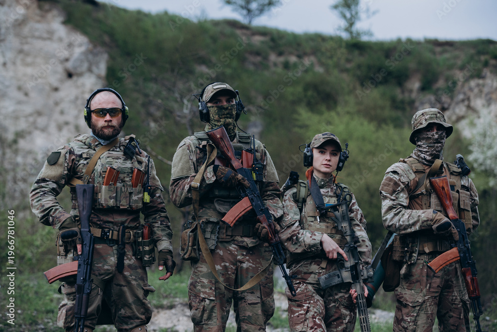 Fototapeta premium Tactical group of Ukrainian armed forces looking in the camera