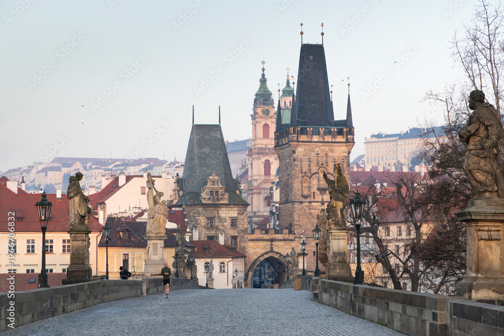 Fototapeta premium charles Bridge in Prague Czech Republic at sunrise with historic statues