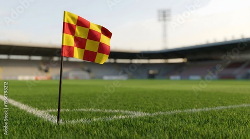 Football corner flag on field with blurred stadium background.