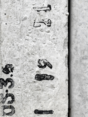 Grungy Urban Concrete Surface with Stenciled Numbers and Text