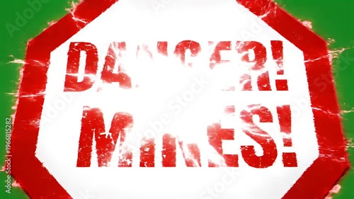 Danger Mines Sign Zooming in on Green Background Alerting