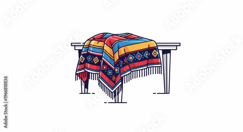 Colorful textile with fringe draped over a white table
