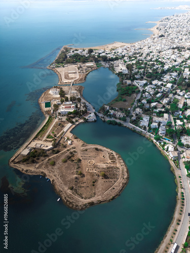 Aerial view of the ancient Punic Ports of Carthage archaeological site and the Mediterranean coastline in Tunis, Tunis Governorate, Tunisia.