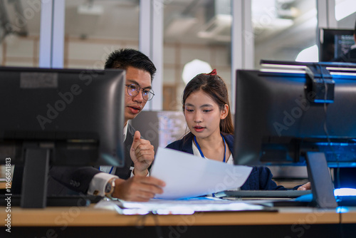 Group of programmers are brainstorming and working at the office.