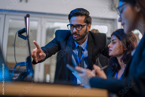 Group of programmers are brainstorming and working at the office.