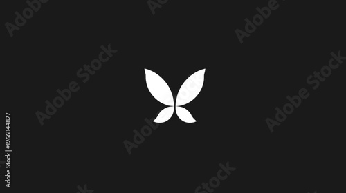 Elegant white abstract butterfly or fairy wing symbol on a dark black background. Modern minimalist graphic design element.
