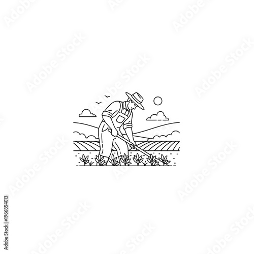 Man in a field with a hoe in his hand