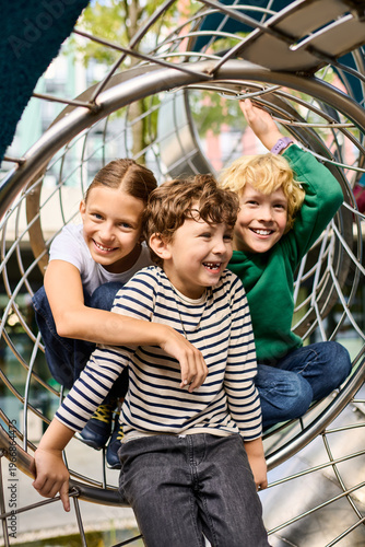 Bild auf Leinwand Childhood joy captured in autumn fun at the playground with friends