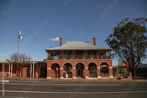 Historic red brick Wellington Post Office building with arched facade and upper balcony