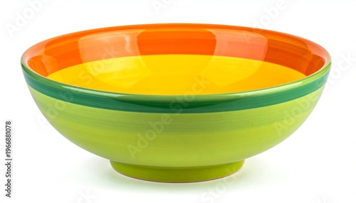 A vibrant green bowl filled with creamy yellow soup on a white background.