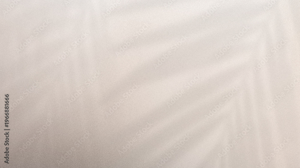 Obraz premium Blurred beige background with subtle leaf shadows and soft gradient texture