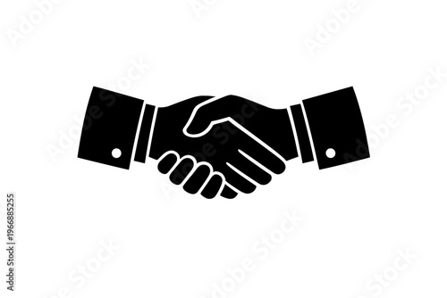 Silhouette of two hands shaking in a symbolic gesture of agreement and partnership