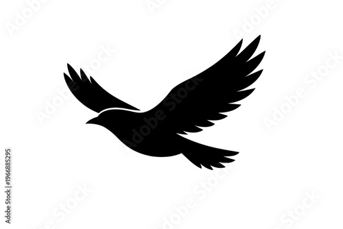 Silhouette of a flying dove with outstretched wings in mid-air