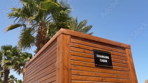 Seaside Changing Shelter Scenic. Wooden Seaside Changing Booth Situated Under Clear Sunny Sky