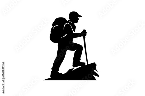 Silhouette of male hiker climbing mountain with backpack and walking stick