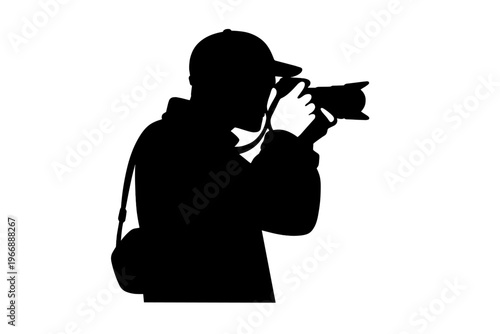 Silhouette of male photographer holding camera with telephoto lens