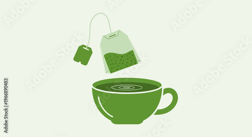 Green Tea Bag Being Dipped into a Cup of Hot Tea