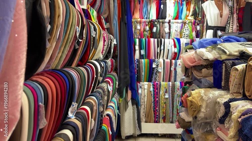 Energetic Retail Space Featuring Variety Of Luxurious Textiles And Elegant Dress Displays