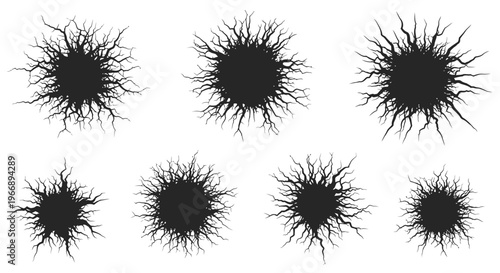 Black Cracked Hole Silhouettes Set Breaking Through Surface for Damage, Destruction, and Grunge Graphic Design