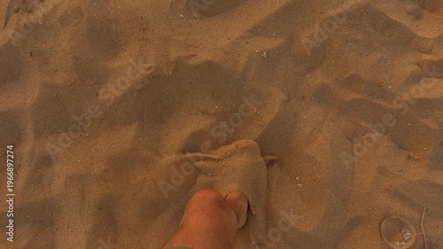 Serene Barefoot Stroll At Sunset Shore. Gentle Footprints Left In Warm Summer Evening Sand