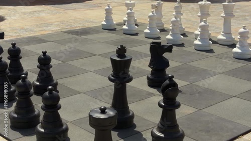 Large Chess Setup. Massive Chess Board Outdoors With Strategic Positioning And Detailed Textures