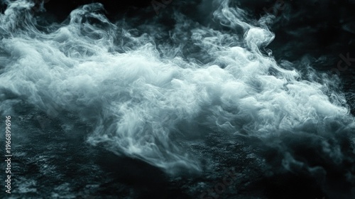 Dramatic swirling vaporous fog on a dark background creating an eerie atmosphere
