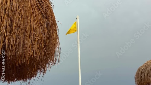 Swimmers Alerted As Lifeguards Assess Severe Weather And Water Conditions Nearby