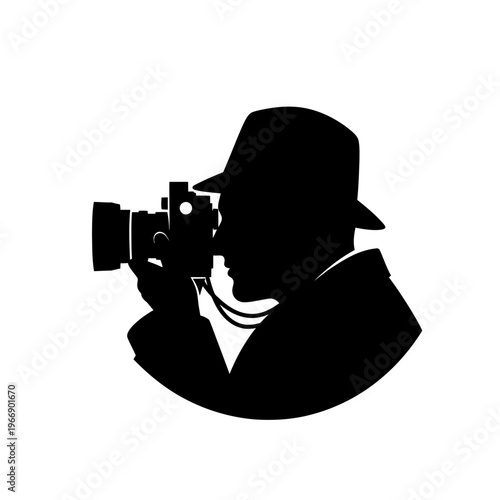 Silhouette of photographer with camera and fedora hat taking photo.