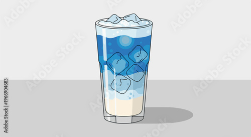 Refreshing blue beverage with ice cubes and foam in a tall glass