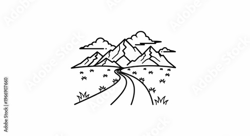 Winding road leads through grassy field to distant jagged mountains