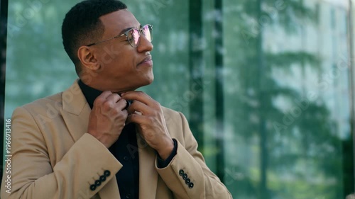 African American business man in city struggling breathe coughing gasping sick with asthma outdoors male entrepreneur businessman throat pain suffocating unbuttoning collar ill unwell emergency health