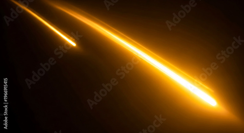 Two bright yellow lines shining on a dark background