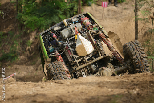 Red Pickup off road  4WD spin mud dirty track on mountain hill.     