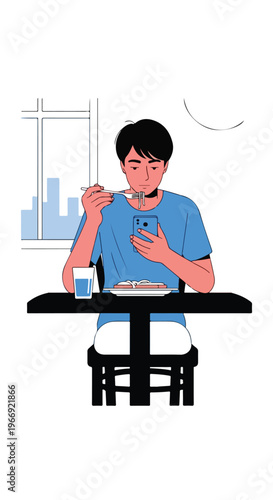 A young man sitting at a table eating dinner while looking at his smartphone