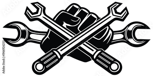 Clenched fist holding crossed wrenches black and white