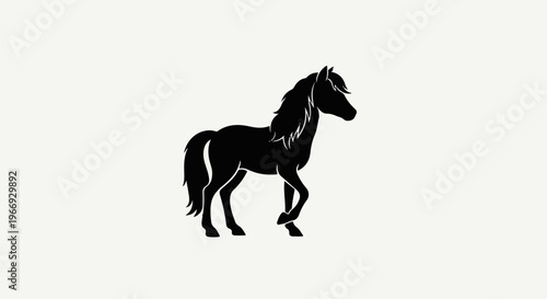 Silhouette of a black horse with a flowing mane and tail