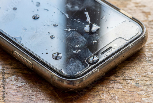 Smartphone with Water Splashes and Realistic Droplets, Waterproof Technology Concept with Detailed Texture