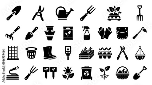 Collection of garden tools and supplies for planting and cultivating plants in a home garden setting