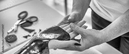 Wallpaper Mural Hand splint application by a professional therapist in a modern physiotherapy center Torontodigital.ca