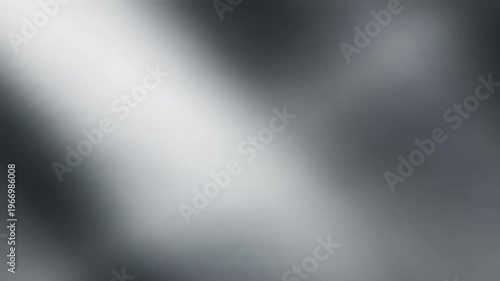 Dynamic silver-grey gradient background with a bright, ethereal diagonal light beam, perfect for modern digital displays, abstract video sequences, or futuristic graphic designs