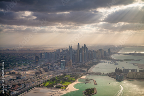 Photography Panoramic perspective from helicopter capturing Dubai’s modern skyscrapers, wate