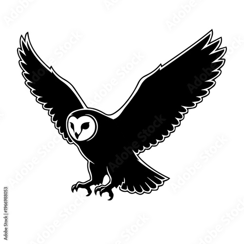 Graceful flight of a black and white barn owl in mid-air with outstretched wings