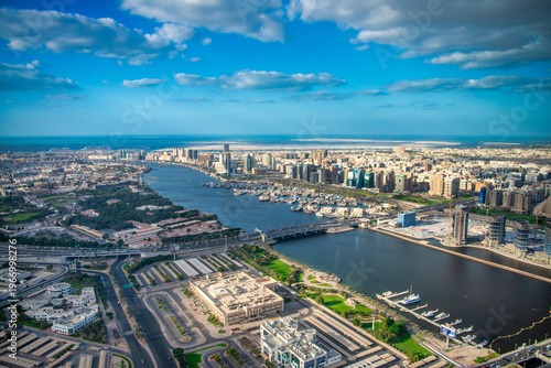 Photography Aerial view captures Bur Dubai's historic skyline with Dubai Creek winding throu