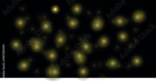 Abstract bokeh lights a dark background with blurry golden and yellow orbs