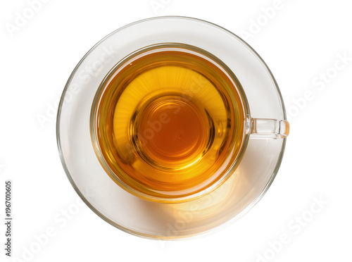 Fotografie Overhead view of a transparent glass teacup filled with golden amber tea, restin