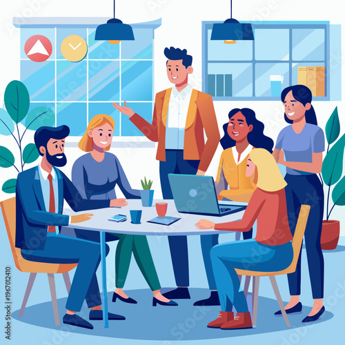 A group of people sitting around a table with a laptop and looking happy