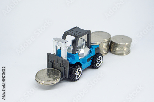 Cuadro en lienzo Toy Forklift Lifting Silver Coins Symbolizing Financial Growth and Economic Weal